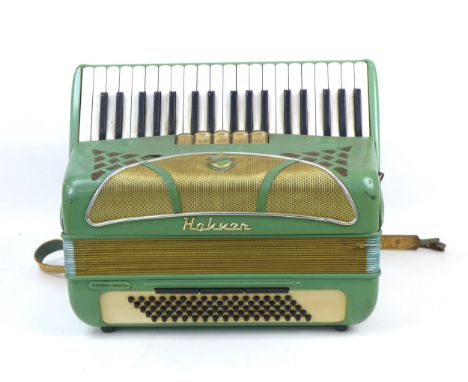 A vintage Hohner piano accordion, Lucia II Musette, pale green, in working order. 