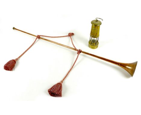 A Victorian copper coaching horn, with applied brass maker's mark and inscribed 'London & Canterbury', with modern pink rope 