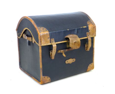 An early 19th century a black painted canvas over wicker travelling trunk, with leather corners, handles, and straps, the ins