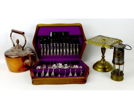 A collection of copper and brass wares, including a Sumerling & Co. copper tea dispenser, a copper kettle, brass based oil la