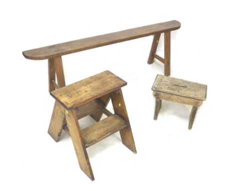 Three wooden stools, comprising a bench, 158 by 33.5 by 49cm high, a one step stool, 45.5 by 56 by 48cm high, together with a