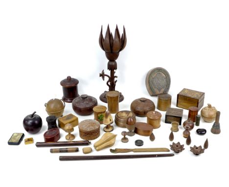 A large collection of treen items, including a mauchline ware money box, 8 by 6 by 4.5cm high, together with fruit form trink