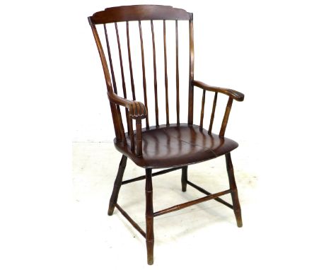 An American 19th century 'Windsor' style open armchair, the high back with a stepped top rail supported on seven slender stic