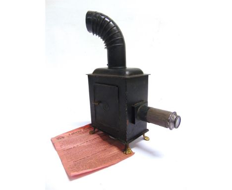 A GERMAN CHILD'S MAGIC LANTERN  complete with oil burner, chimney, original instruction sheet, and thirteen colour-printed gl