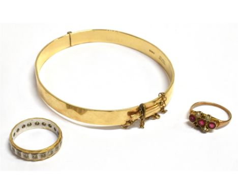 THREE ITEMS OF JEWELLERY  Clear quartz set yellow and white metal eternity ring, size L ½ , weight 3.3g, a 9CT gold metal cor