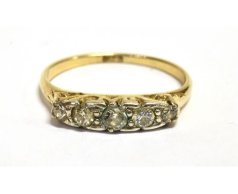 RETRO DIAMOND DRESS RING The narrow band ring set with five small single cut diamonds set in white metal on a yellow metal sh