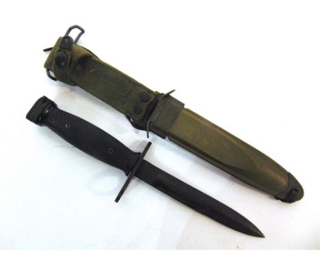 MILITARIA - A U.S. M8A1 KNIFE BAYONET  with a 16.5cm blackened blade, in its scabbard, overall 32.5cm long.