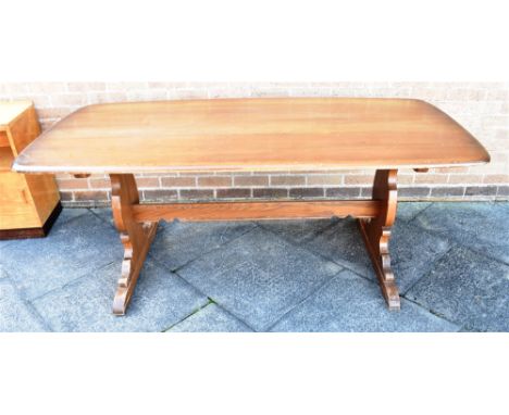 AN ERCOL REFECTORY DINING TABLE  the rectangular top 88cm x 183cm, on shaped supports united by strecher Condition Report : o