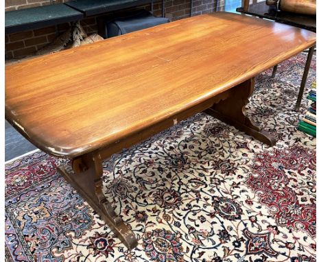 AN ERCOL REFECTORY DINING TABLE  the rectangular top 88cm x 183cm, on shaped supports united by strecher Condition Report : o