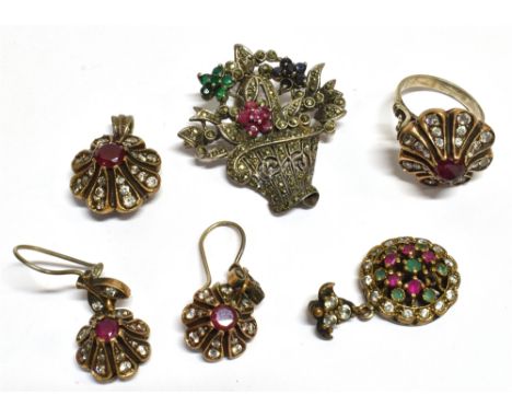 A COLLECTION OF MIDDLE EASTERN 925 WHITE METAL, GEM AND STONE SET JEWELLERY A white metal brooch/pendant designed as a flower