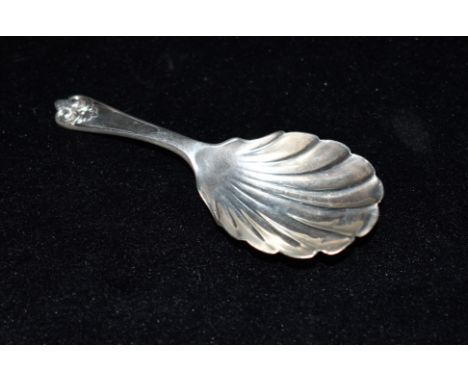 A SILVER TEA CADDY SPOON The spoon with Albany tip and shell bowl, hallmarked for London, date letter S, length 9cm