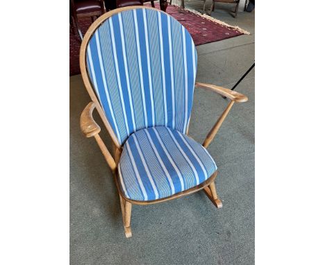 A LIGHT ERCOL ROCKING WINDSOR ARMCHAIR  with stickback, and solid seat, with seat and back cushions Condition Report : solid 