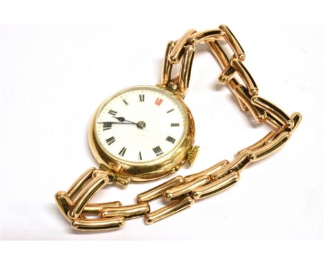A 15CT GOLD CASE VINTAGE WRISTWATCH anonymous white enamel dial, black Arabic numerals (Red 12), gilt markers, blue batons, p