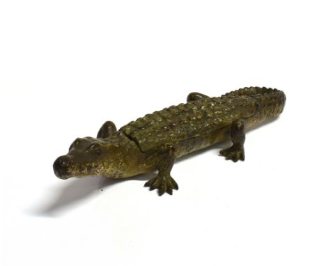 AN AUSTRIAN COLD PAINTED BRONZE ALLIGATOR IN THE  MANNER OF FRANZ BERGMANN  with hinged compartment to back with vesta strike