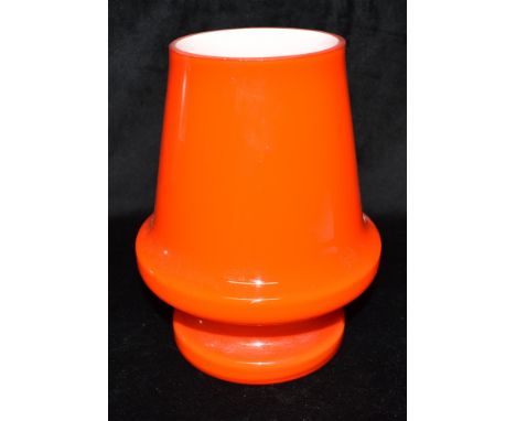 AN ORANGE CASED GLASS LAMP BY FLYGSFORS, SWEDEN  29cm high (lacking electrical fittings) Condition Report : good condition Co