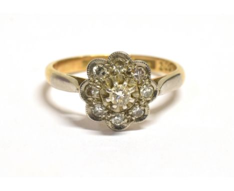 VINTAGE MARKED 18CT PLAT DAISY DIAMOND RING The diamond daisy set in platinum on a yellow gold shank, maker LWG, the daisy me