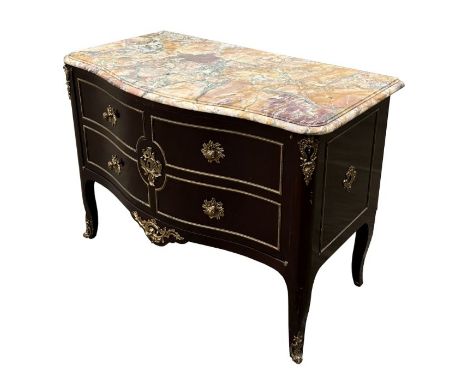 A Louis XVI style serpentine marble topped French commode, the pair of panelled doors with faux drawer fronts and gilt ormolu