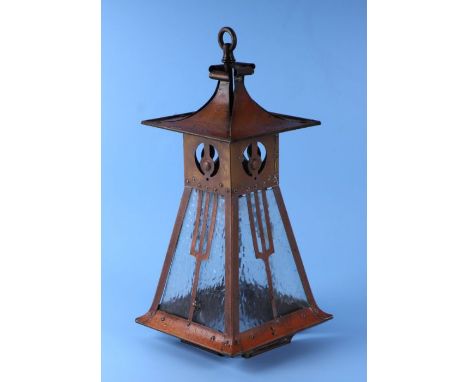 An Arts &amp; Crafts brass hall lantern with glazed panels, 43cms high.Condition ReportGeneral wear, the glass panels are int