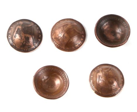 A set of five WW1 British army Brodie helmets made from English copper pennies, each coin dated for a year of the First World