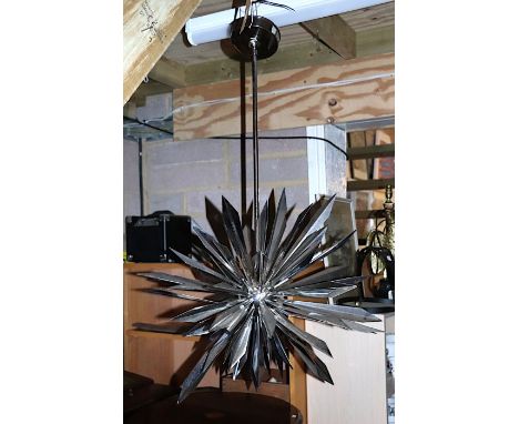 A California Sunburst 45 chandelier designed by Tony Duquette for Remains Lighting, constructed from stainless steel and nick