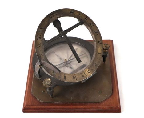 A Troughton &amp; Simms of London brass and steel universal equinoctial sundial on a brass mounted mahogany stand, 21.5cm wid