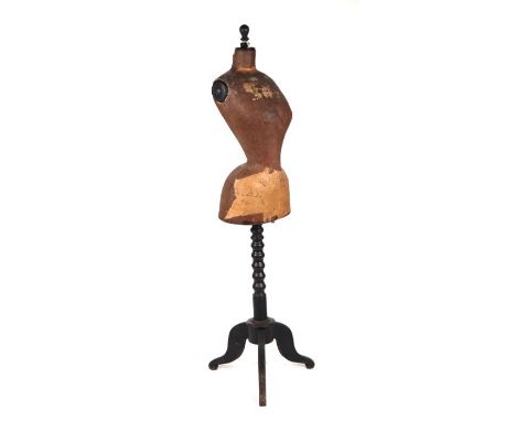 A 19th century dressmaker's wasp waist mannequin, the waisted papier-mâché body above a turned column and tripod base.