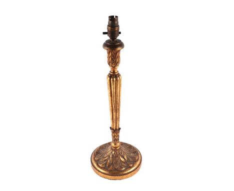 A carved giltwood table lamp with tapered reeded column and acanthus leaf carved finial and base, 41cms high.