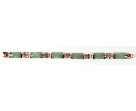 A Chinese 9ct gold and jade panel bracelet, 18cms long.