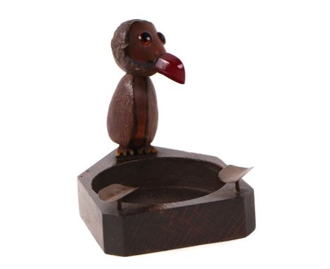 A novelty Henry Howell style ashtray in the form of a bird with what looks to be a cherry amber Bakelite beak, 13cms high.