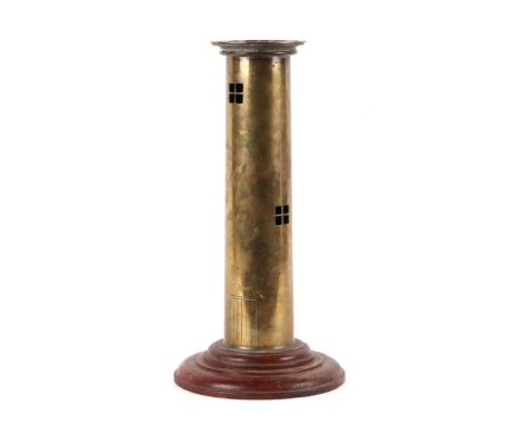 A trench art WWI brass artillery shell converted to a table lamp in the form of a lighthouse, on a turned wooden base, 44cms 