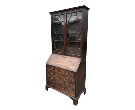 A George III mahogany bureau bookcase, the upper section with twin astragal glazed doors enclosing adjustable shelves, above 