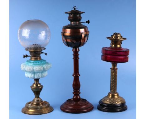 Two Victorian oil lamps; together with a copper oil lamp on a mahogany stand (all a/f) (3).Condition ReportThe copper oil lam