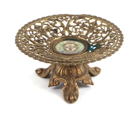 Military interest:  a 19th century pierced brass tazza with central enamel plaque 'Blessed Are The Merciful Crimea', 20cms di