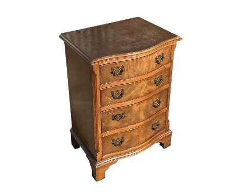 A Shaw of London George III style serpentine walnut chest of drawers of small proportions with four graduated drawers, on bra