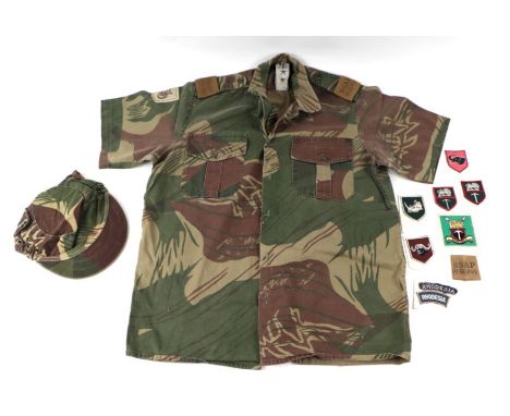 A Rhodesian BSAP Reserve camouflage uniform and various Rhodesia Army cloth badges.Condition ReportThe shirt is 41/16 and the