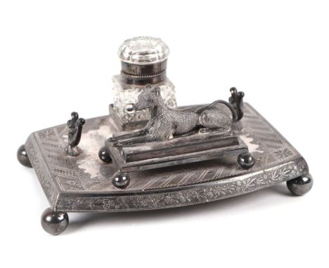 A late Victorian / Edwardian Deakin &amp; Son silver plated pen &amp; ink desk stand with glass inkwell, surmounted a figure 