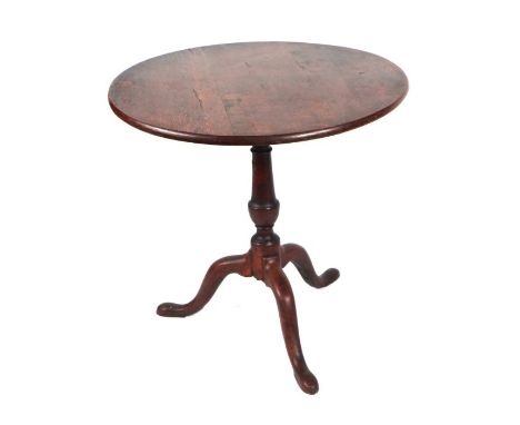 A 19th century oak tripod table with birdcage movement, the turned column on a tripod base with slipper feet, 73cms diameter.