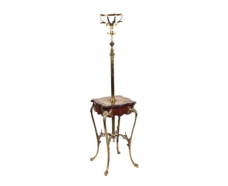 A French Empire style brass and mahogany oil lamp table with acanthus leaf capped sinuous legs, 36cms wide.