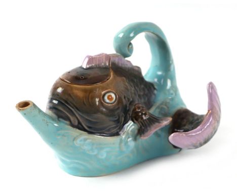 A late Victorian Brownfield majolica teapot and cover in the form of a fish jumping out of the sea, impressed pottery mark an