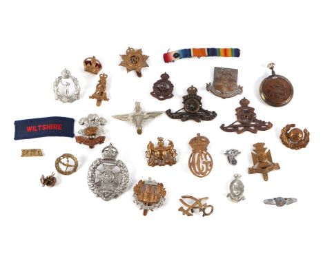 A group of Military and similar cap badges to include Royal Artillery; Royal Army Medical Corp; and the Welch Regiment.