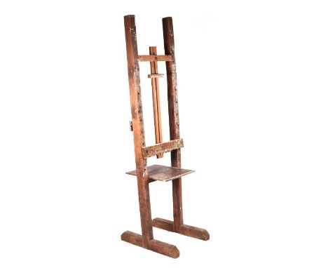 A large floor standing adjustable artist's easel.