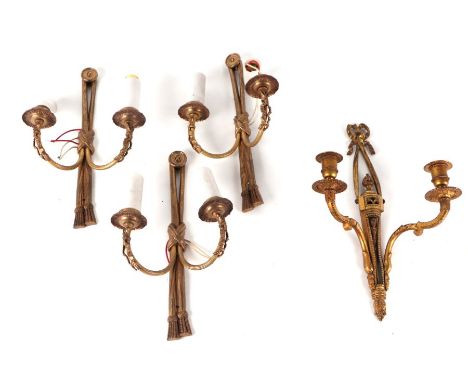 A set of three gilt metal twin-arm wall lights; together with another twin-arm wall light (4).Condition Reportset of three 31