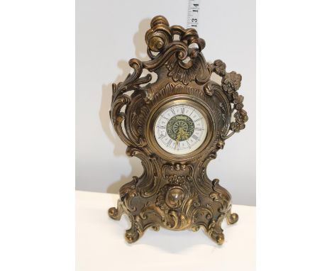 A cast metal mantel clock 