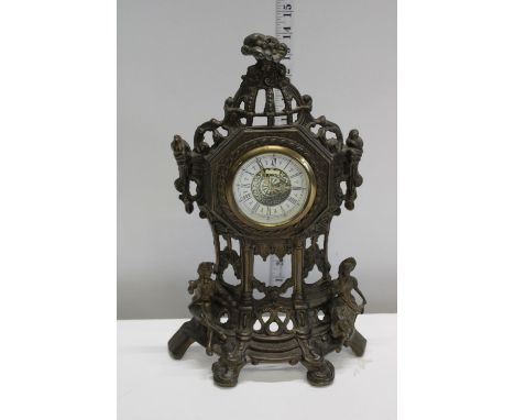 A cast metal mantel clock 