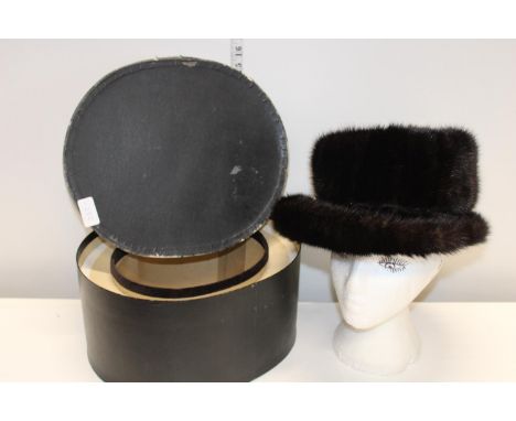 A vintage mink hat in original box 