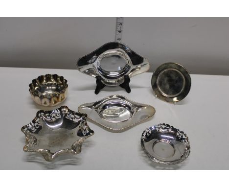 A shelf of assorted silver plated ware 