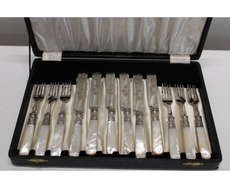 A cased set of vintage pearlescent handled cutlery 