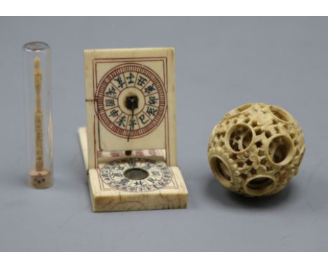 A Chinese ivory zodiac compass, a puzzle ball and a 19th century carved matchstick