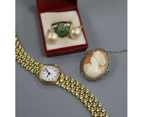 A lady's Mappin and Webb wrist watch, a yellow metal and emerald cluster dress ring, a cameo brooch and pair of ear studs.