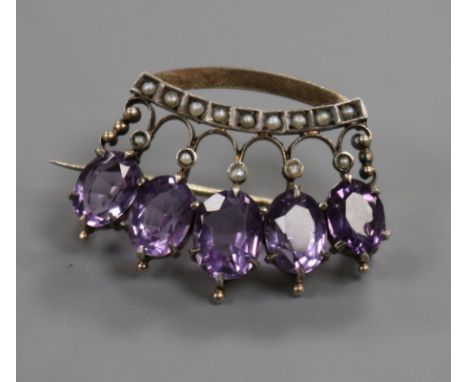 A 19th century yellow metal, amethyst and split pearl set coronet brooch, 30mm.